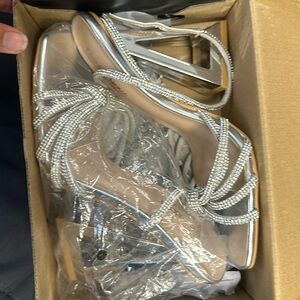 Silver strappy heels size 7.5, never worn